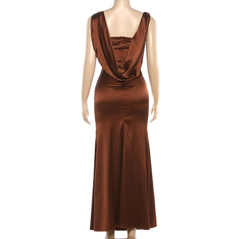 Brown evening gown on a mannequin against a white background