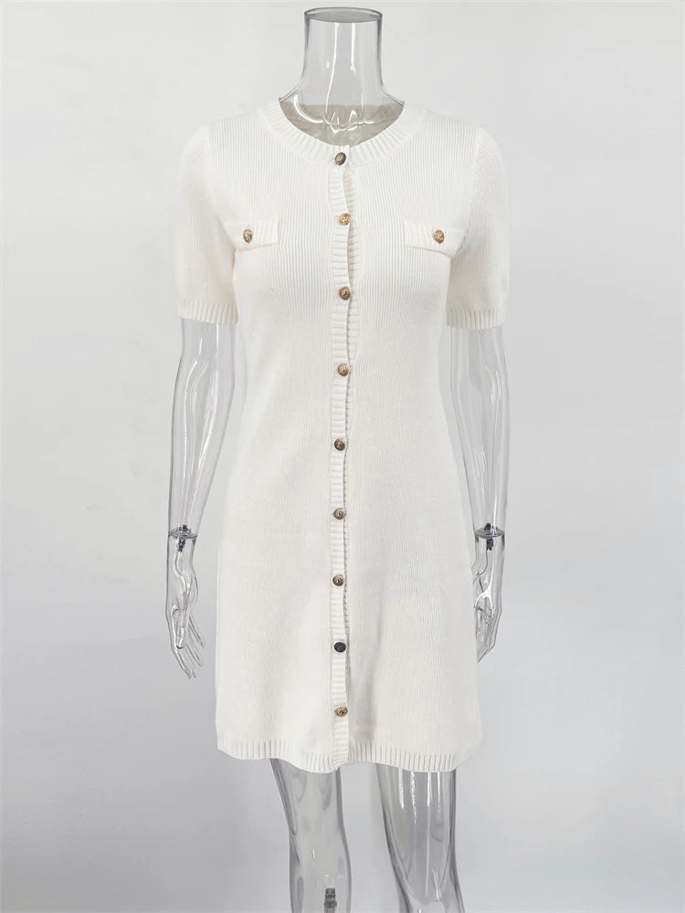 White cardigan with sheer sleeves on a mannequin against a white background