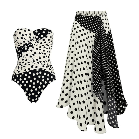 Polka dot strapless swimwear set with wrap detail and asymmetrical skirt.