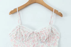 Close-up of the ruched bodice and lace trim on a midi dress