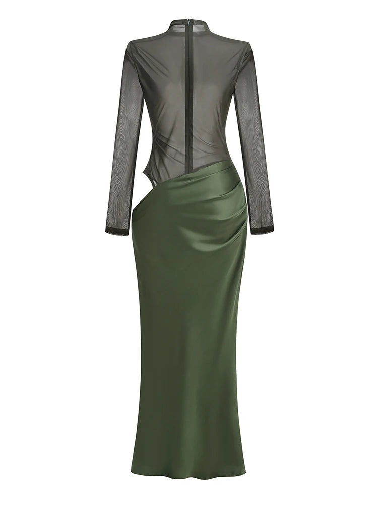 Green dress with sheer long sleeves on a white background
