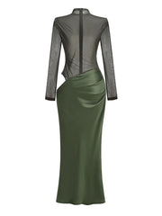 Green dress with sheer long sleeves on a white background