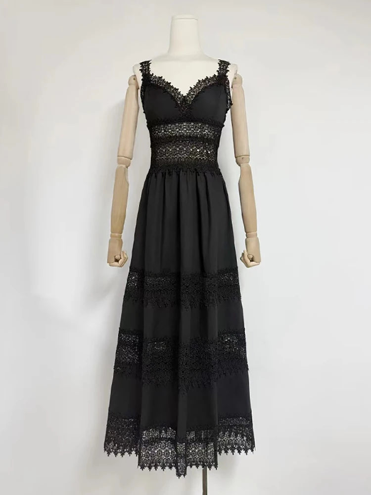 Black lace dress on a mannequin against a white background