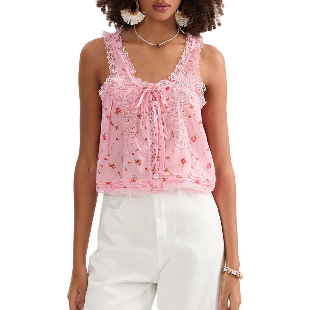 Woman wearing a pink lace top with floral patterns on a white background