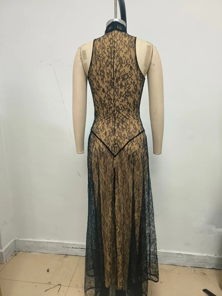 Lace dress on a mannequin against a plain background