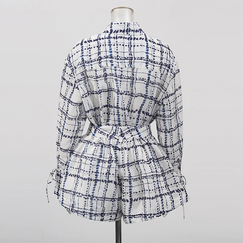 Plaid shirt and shorts set on a mannequin against a gray background