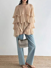 Lightweight woven blouse shown in a soft, romantic silhouette