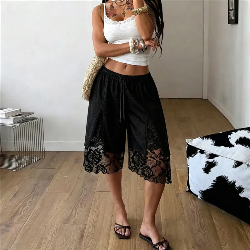 Black lace trim split capri shorts indoors