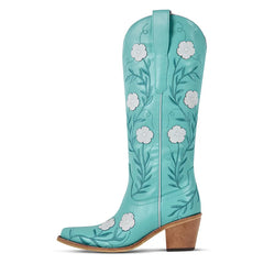 Turquoise cowboy boot with white floral designs on a white background