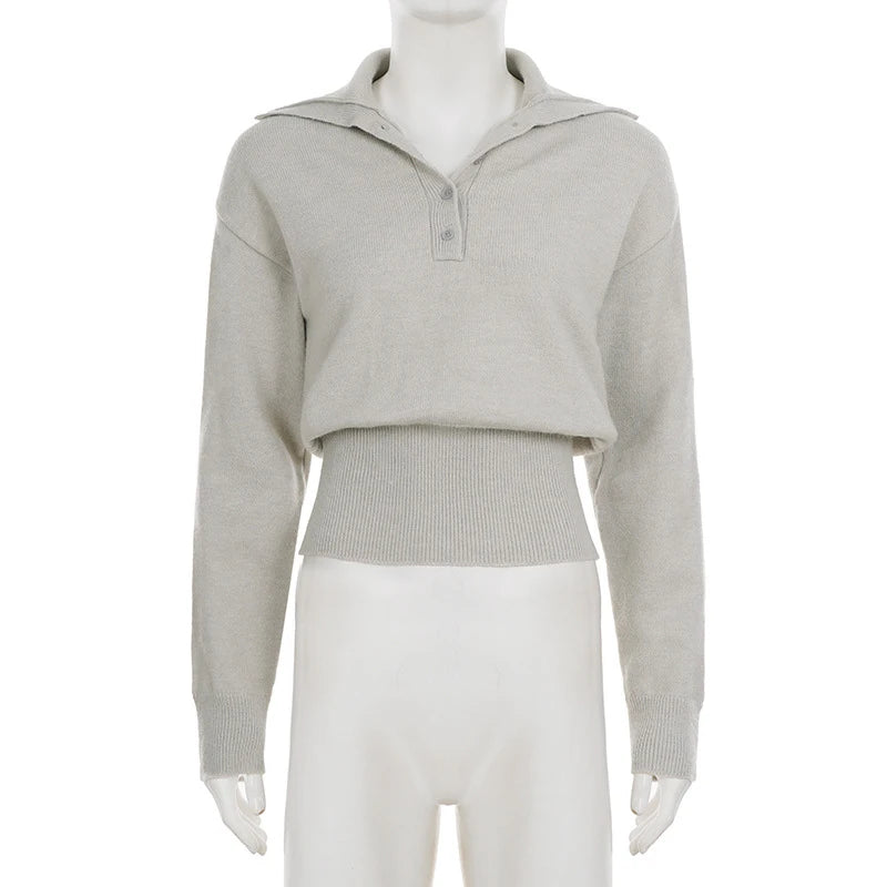 Close-up of knit polo collar showing textured ribbing and relaxed buttonless placket