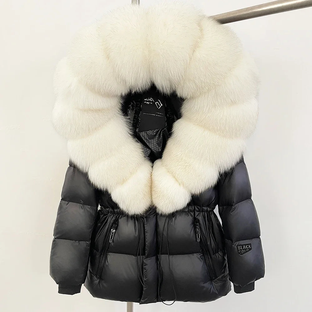 Hooded down jacket with a large white fur trim.