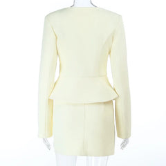 An apricot suit on a mannequin against a white background
