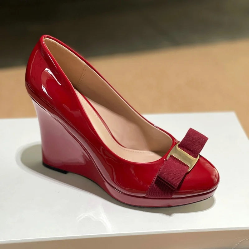 Red patent leather bow platform wedge pump