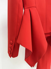 Close-up detail of the peplum and sleeve on red blazer