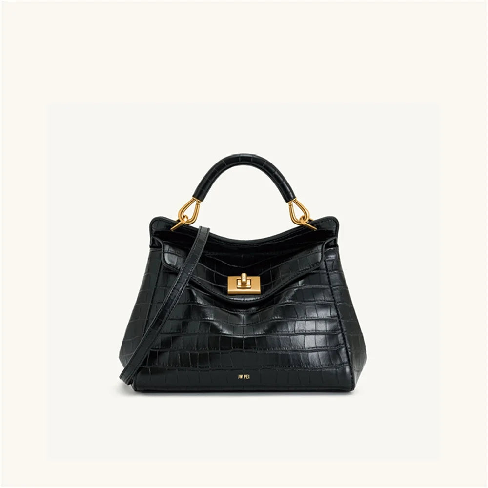 Black crocodile embossed top handle bag with gold hardware.