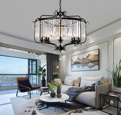 Modern crystal chandelier with LED lights, hanging in a stylish living room. Golden Atelier 2