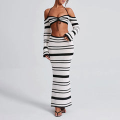 Black and white striped outfit on a plain background