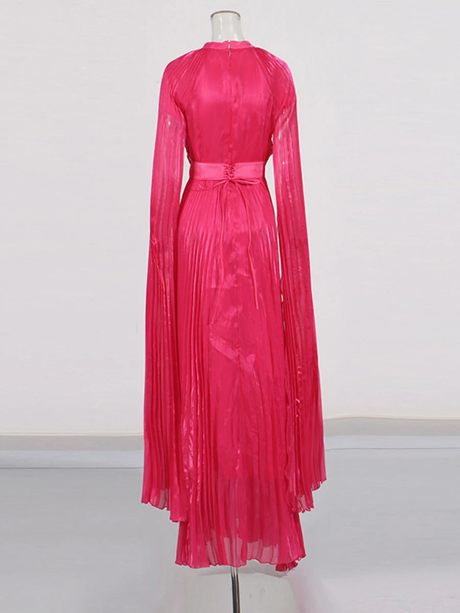 Pink dress on a mannequin against a white background