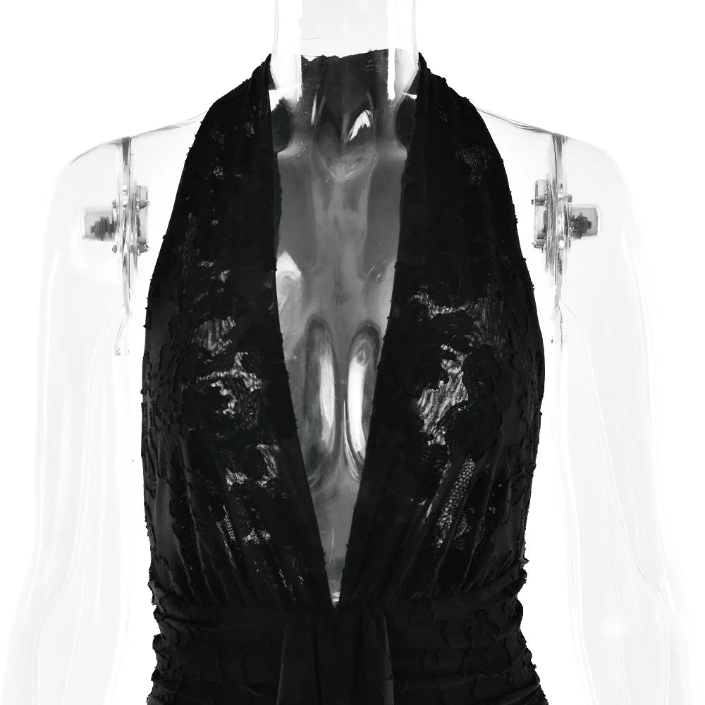 Black sequin dress on a mannequin against a white background