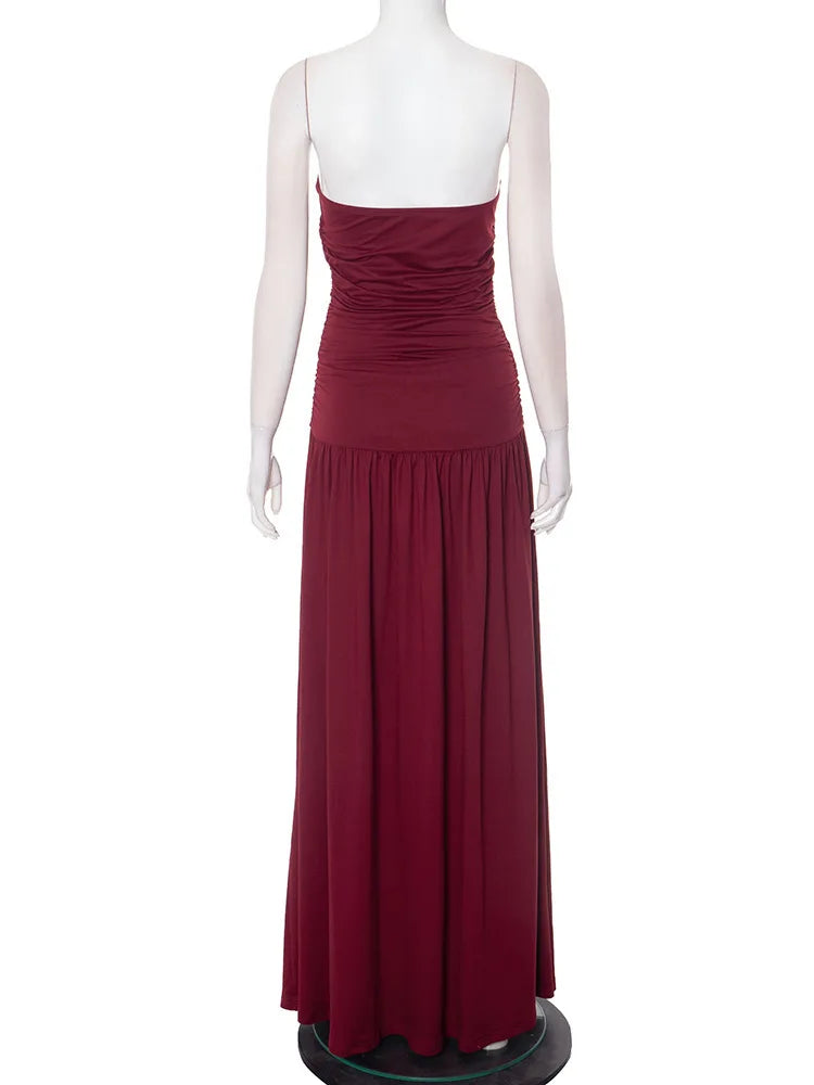 Maroon evening gown on a mannequin against a white background