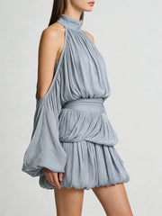 Blue dress with a halter neck and layered design on a plain background