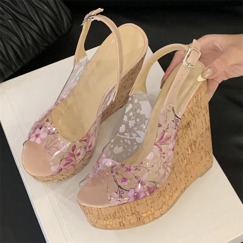 Wedge sandals with floral design on a white surface