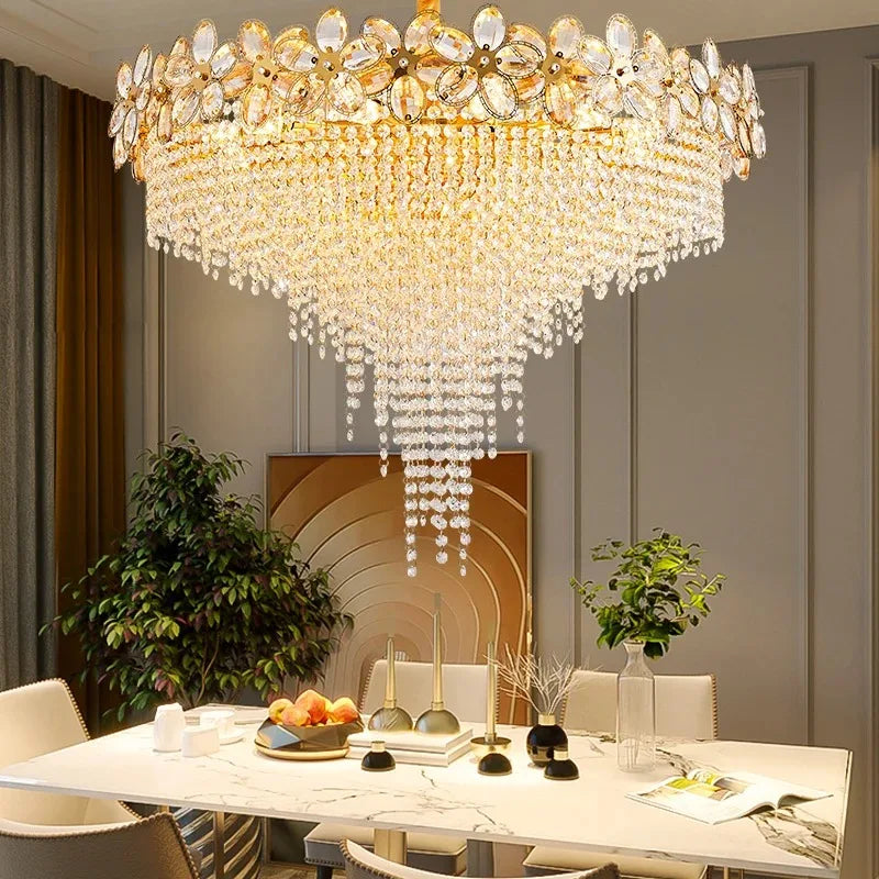 Luxurious chandelier hanging above a dining table in a stylish room.