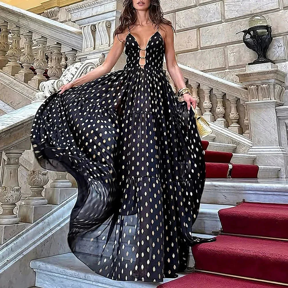 Woman in black and gold polka dot maxi Skirt on marble stairs