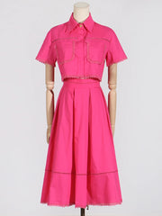 Pink dress on a mannequin against a white background