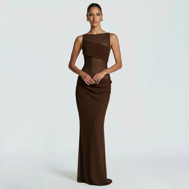 Woman wearing a brown evening gown on a light gray background