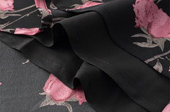 Close-up of fabric texture and hem on floral print maxi dress