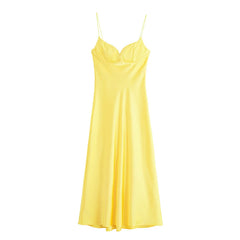 Yellow slip dress on a white background