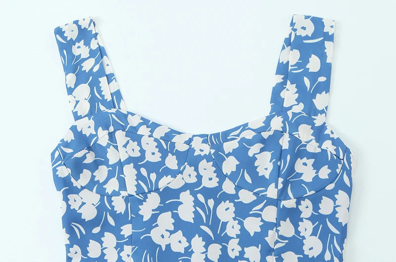 Close-up of the square neckline and floral print on a midi dress
