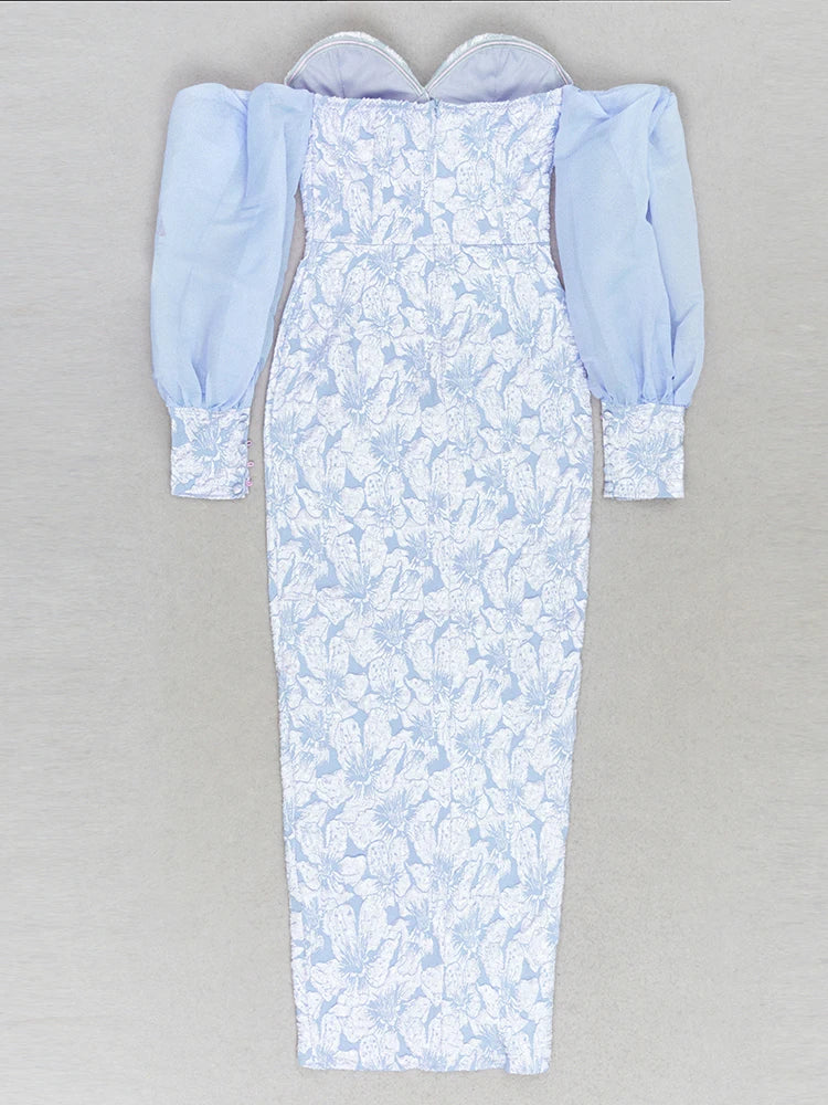 Long light blue dress with floral pattern on a gray background