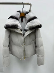 Gray puffer jacket with a fur-lined hood on a white background