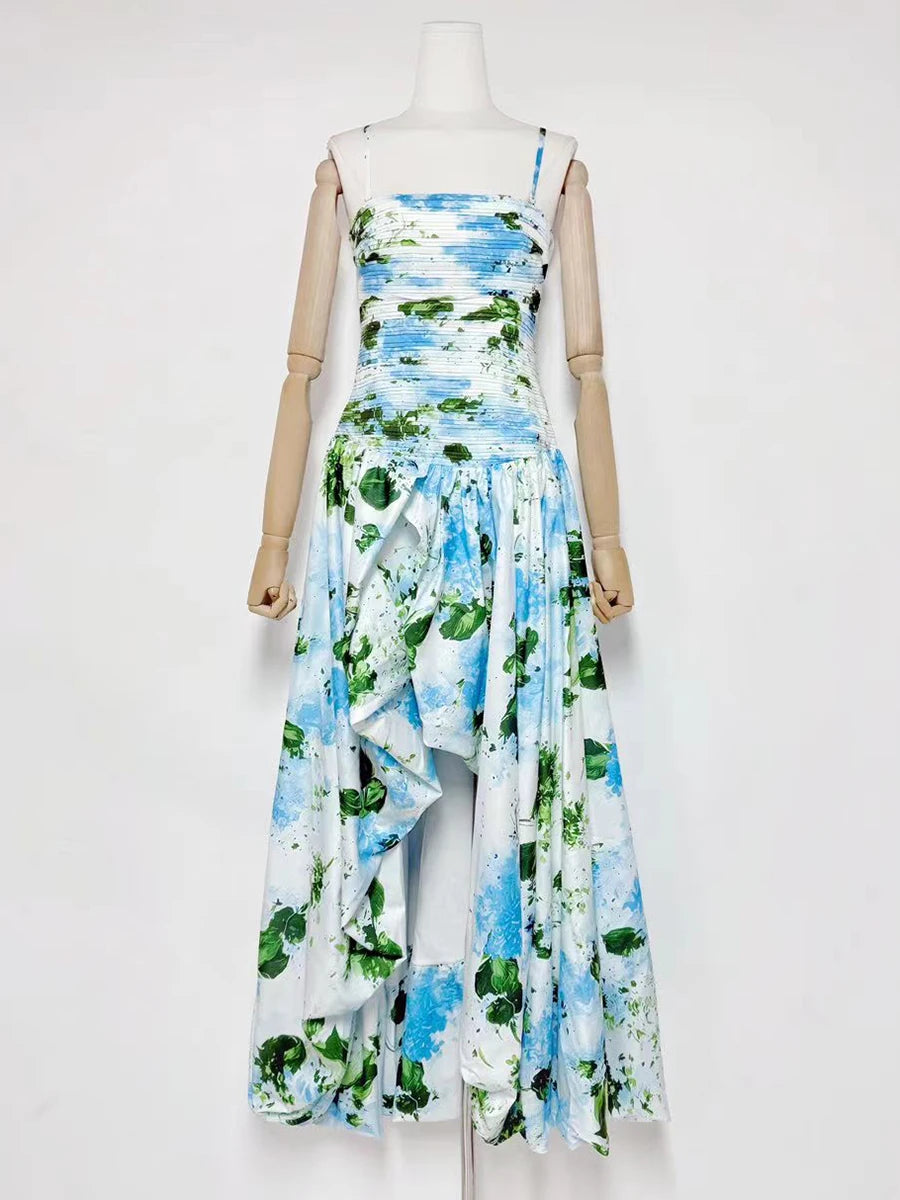 Mannequin wearing a floral dress with blue, green, and white pattern