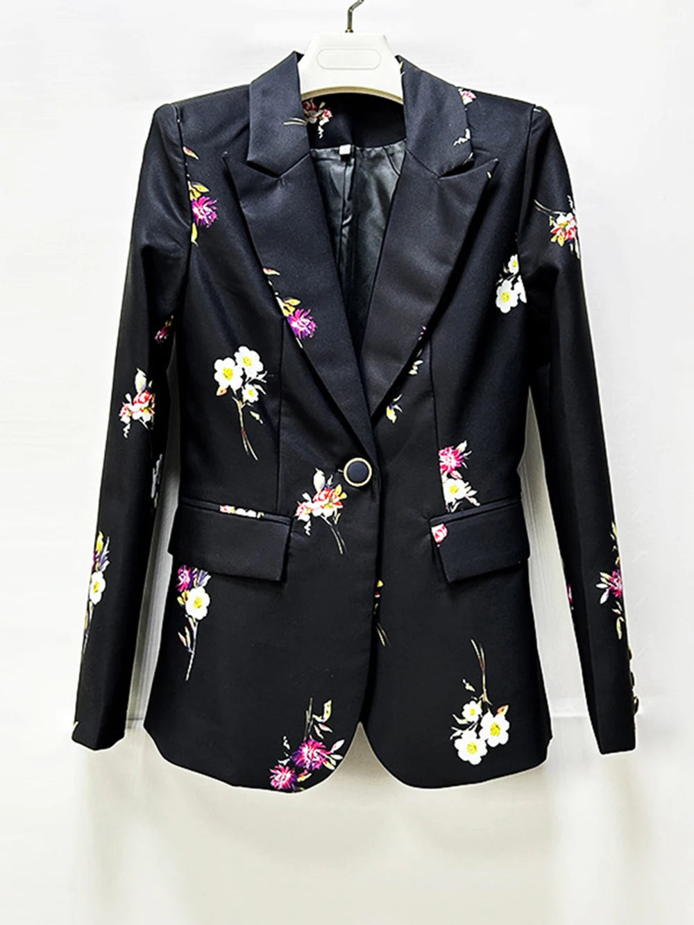 Close-up of the black floral print blazer.