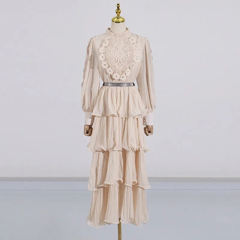 Beige lace dress on a mannequin against a plain background