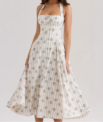White floral dress on a gray background