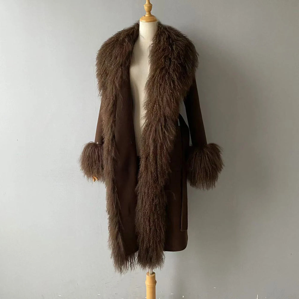 Brown fur coat on a mannequin against a plain background