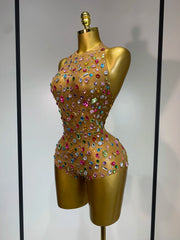Close-up of rhinestone detail on mesh bodysuit