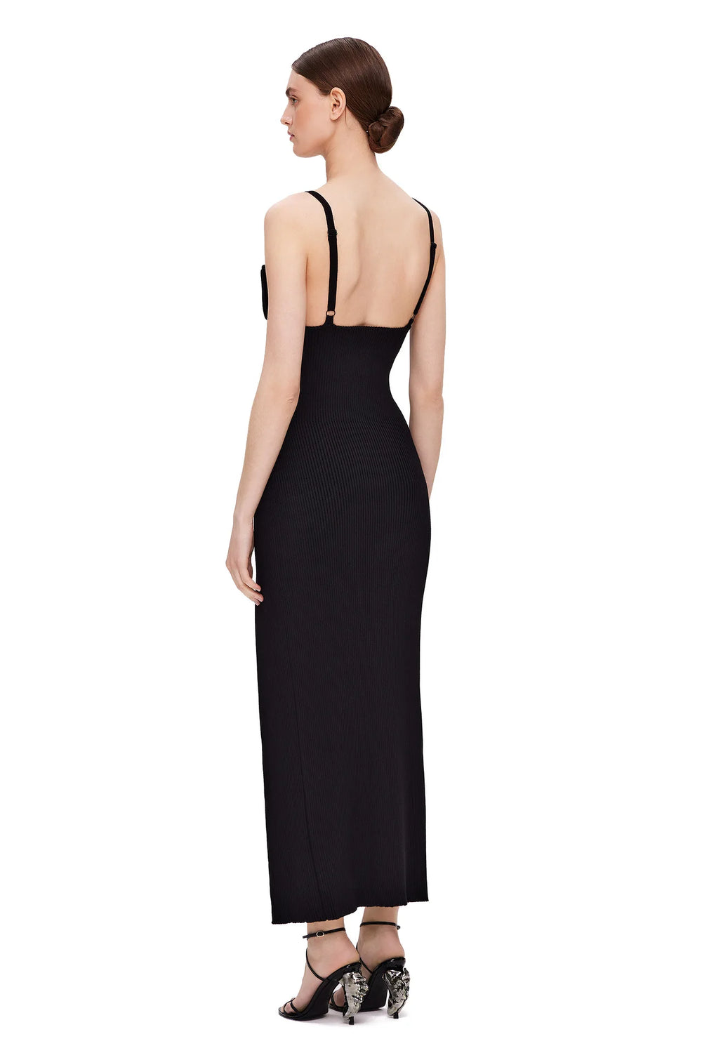 Black evening gown with open back on a white background
