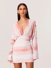 Long sleeve deep v-neck mini dress with tie-dye pattern