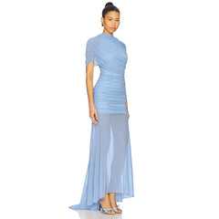 Woman wearing a light blue evening gown on a white background