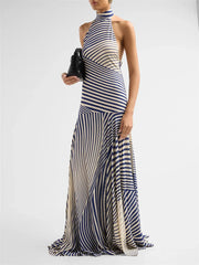 Striped halter maxi dress with clutch bag