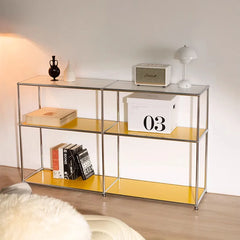 A modern metal sideboard with multiple compartments and shelves, displayed in a stylish living room. D