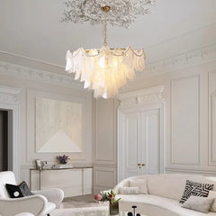 A modern living room illuminated by a statement LED pendant light chandelier. B