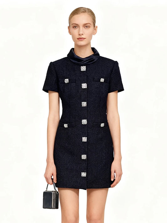 Tailored sheath mini dress shown in a refined silhouette
