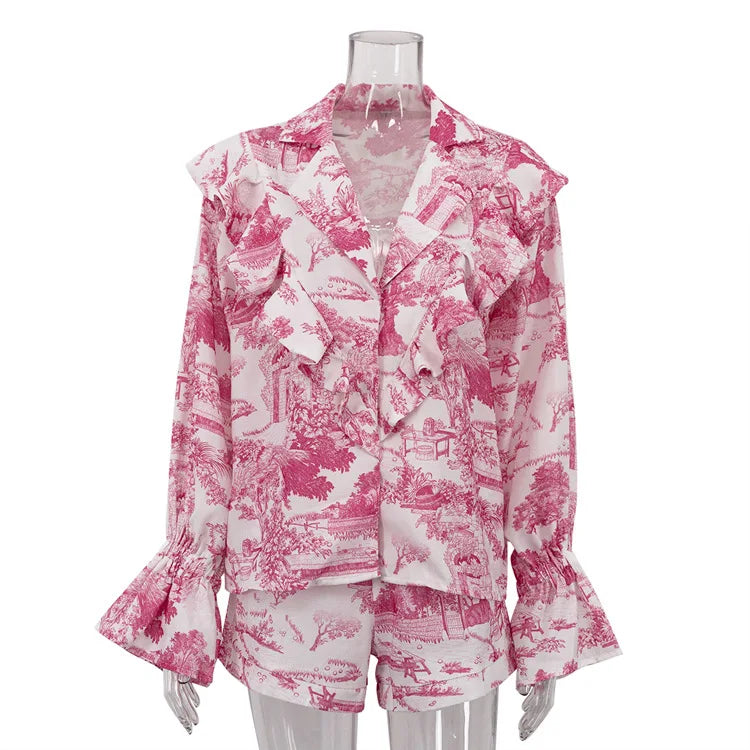 Pink and white patterned blouse on a mannequin against a white background