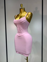 Side view of pink ribbed spaghetti strap mini dress